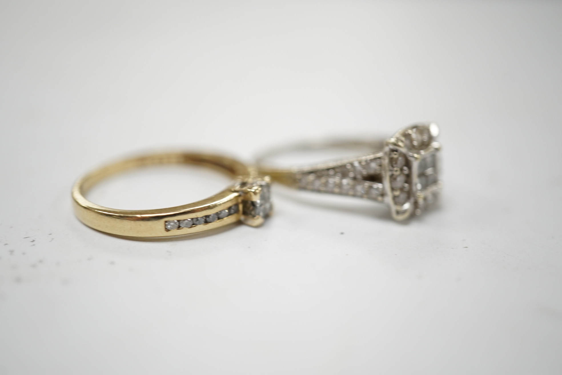 Two modern 9ct gold and diamond cluster set rings, sizes G and M/N, gross weight 4.9 grams. Condition - fair